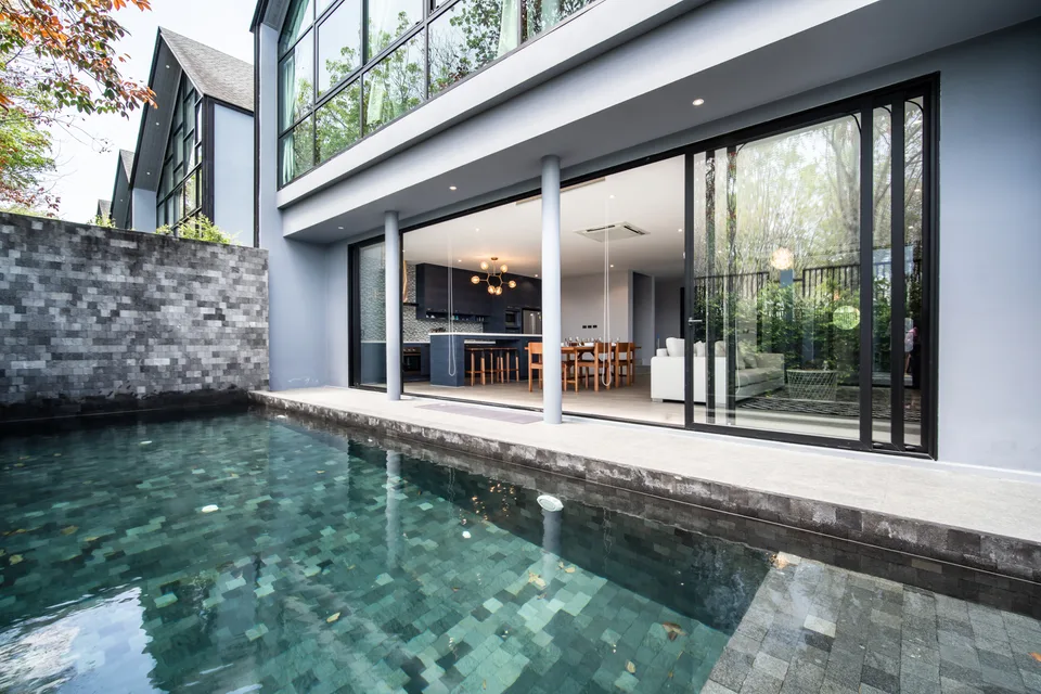 The pool alongside the open living space