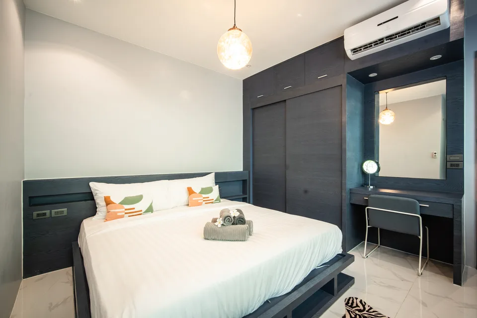 A calm bedroom with en-suite access